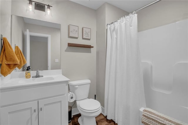 12631 Fountain Lake Cir, Grandview, MO 64030 - bathroom with wood finished floors, vanity, and shower / bath combo