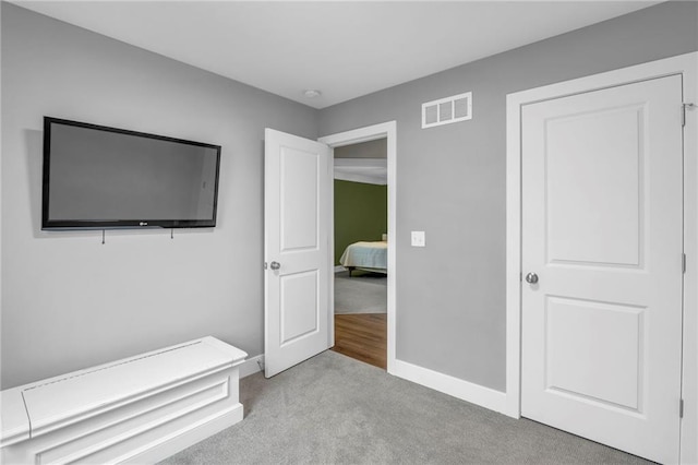12631 Fountain Lake Cir, Grandview, MO 64030 - unfurnished bedroom with carpet and baseboards