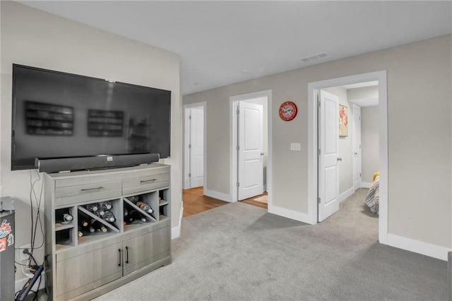 12631 Fountain Lake Cir, Grandview, MO 64030 - carpeted living room with baseboards