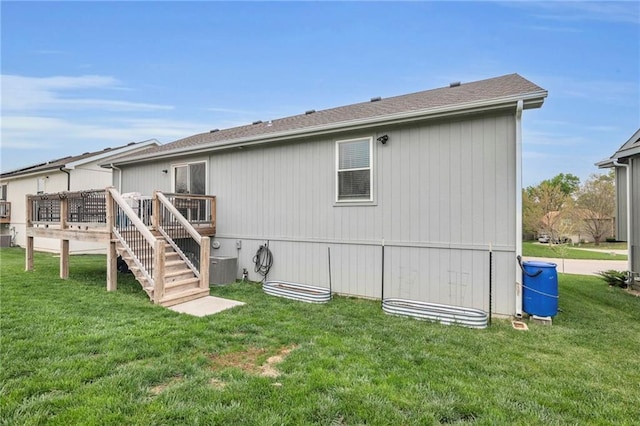12631 Fountain Lake Cir, Grandview, MO 64030 - back of house featuring a wooden deck, a yard, stairs, and a shingled roof