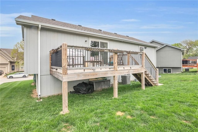 12631 Fountain Lake Cir, Grandview, MO 64030 - rear view of house featuring a deck, a yard, stairway, and a shingled roof