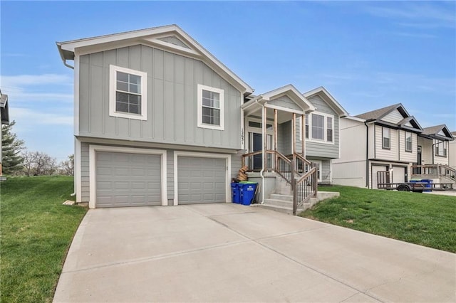 12631 Fountain Lake Cir, Grandview, MO 64030 - view of front facade featuring board and batten siding, a garage, a front yard, and concrete driveway