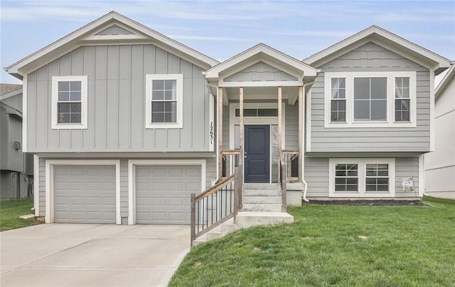12631 Fountain Lake Cir, Grandview, MO 64030 - bi-level home with board and batten siding, a front lawn, an attached garage, and driveway