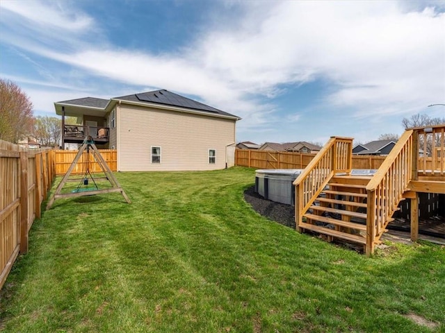 105 Fox Den Ct, Savannah, MO 64485 - exterior space featuring a deck, a fenced backyard, a lawn, and roof mounted solar panels