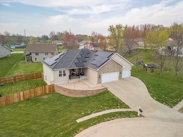 105 Fox Den Ct, Savannah, MO 64485 - view of front facade featuring roof mounted solar panels, a garage, fence, a residential view, and driveway