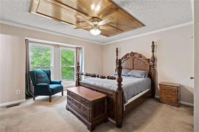 bedroom featuring light colored carpet, a textured ceiling, visible vents, and baseboards