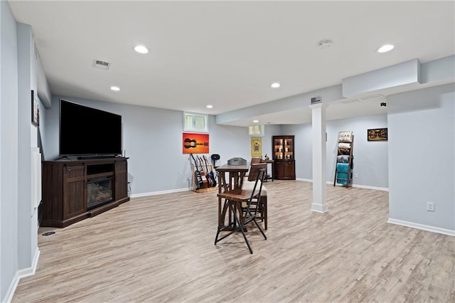 dining room with baseboards, recessed lighting, and light wood-style flooring