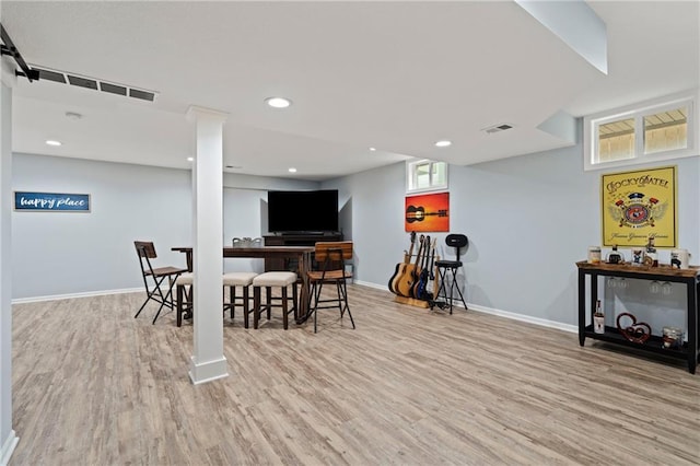 dining room with baseboards, visible vents, and wood finished floors