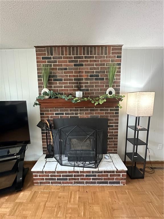 83 Grandview Dr, Warrensburg, MO 64093 - detailed view of a fireplace and a textured ceiling