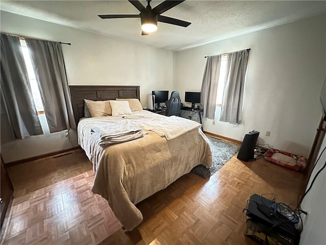 83 Grandview Dr, Warrensburg, MO 64093 - bedroom with multiple windows, baseboards, and a ceiling fan