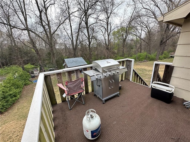 83 Grandview Dr, Warrensburg, MO 64093 - wooden deck with a grill