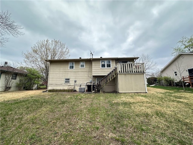 83 Grandview Dr, Warrensburg, MO 64093 - rear view of house with stairs, a yard, central AC unit, and a wooden deck