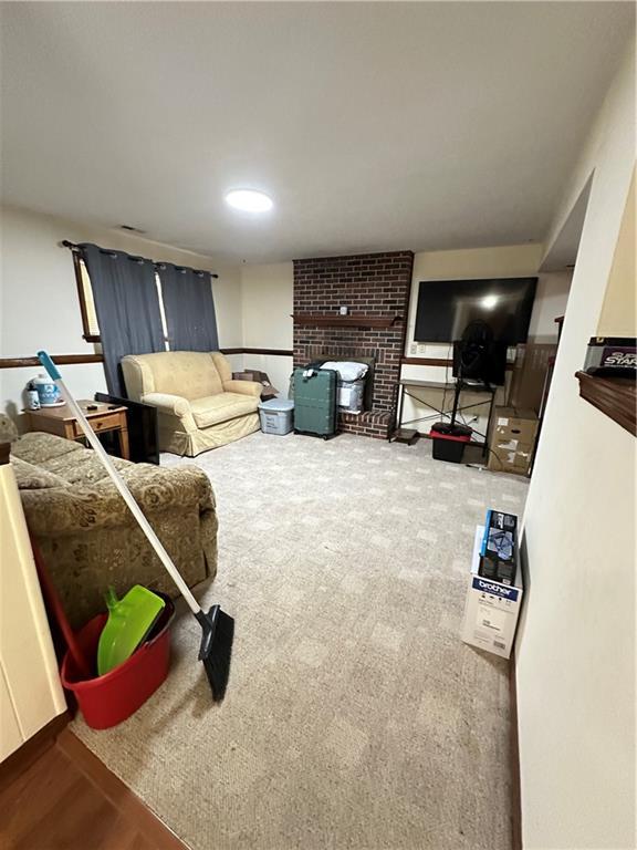 83 Grandview Dr, Warrensburg, MO 64093 - living area featuring a brick fireplace