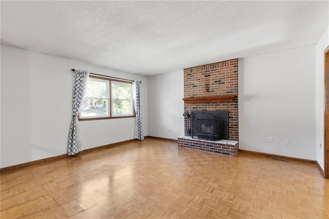 83 Grandview Dr, Warrensburg, MO 64093 - unfurnished living room with a textured ceiling and a brick fireplace