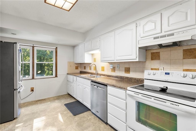 83 Grandview Dr, Warrensburg, MO 64093 - kitchen with stainless steel appliances, under cabinet range hood, white cabinetry, and backsplash