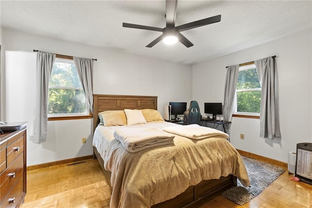83 Grandview Dr, Warrensburg, MO 64093 - bedroom with multiple windows, a textured ceiling, and ceiling fan