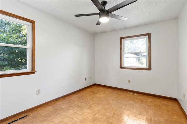 83 Grandview Dr, Warrensburg, MO 64093 - unfurnished room with a textured ceiling and ceiling fan