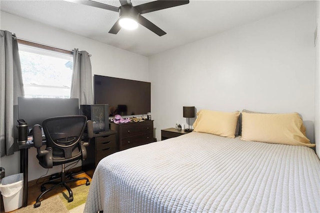 83 Grandview Dr, Warrensburg, MO 64093 - bedroom featuring a ceiling fan and a desk