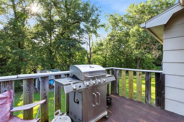 83 Grandview Dr, Warrensburg, MO 64093 - wooden terrace with a grill and a yard