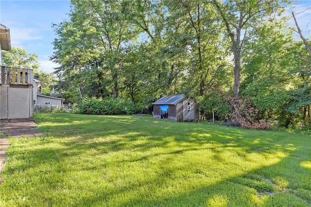 83 Grandview Dr, Warrensburg, MO 64093 - view of grassy yard with a storage shed