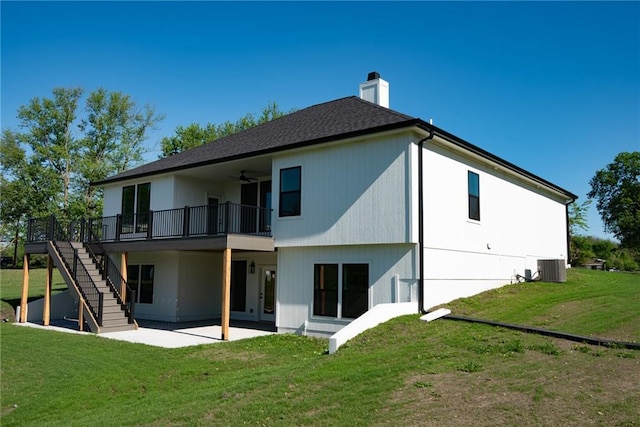 back of house featuring a patio, a chimney, a lawn, central AC unit, and ceiling fan