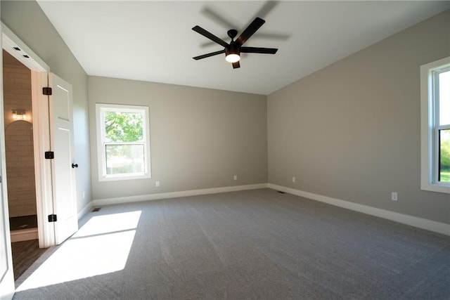 unfurnished bedroom with baseboards, carpet flooring, and ceiling fan