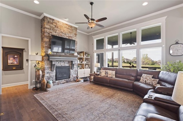 6840 Belmont Dr, Shawnee, KS 66226 - living room with crown molding, baseboards, a ceiling fan, and a stone fireplace