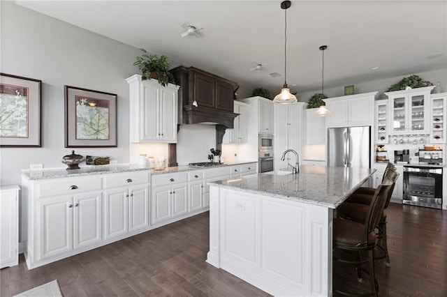6840 Belmont Dr, Shawnee, KS 66226 - kitchen with stainless steel appliances, a sink, beverage cooler, and dark wood finished floors