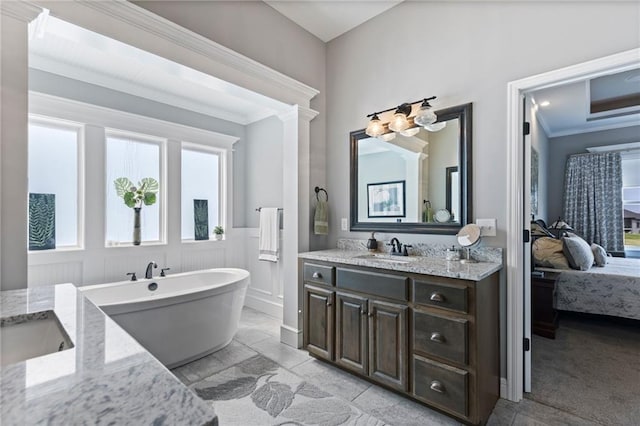 6840 Belmont Dr, Shawnee, KS 66226 - full bath featuring ensuite bathroom, vanity, a chandelier, a soaking tub, and ornamental molding