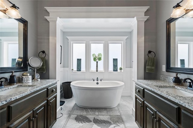 6840 Belmont Dr, Shawnee, KS 66226 - bathroom featuring wainscoting, marble finish floor, crown molding, and a sink