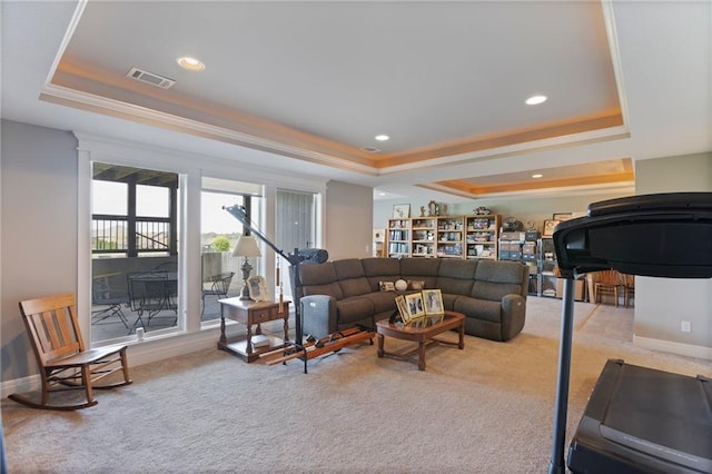 6840 Belmont Dr, Shawnee, KS 66226 - carpeted living room with visible vents, recessed lighting, a raised ceiling, and crown molding