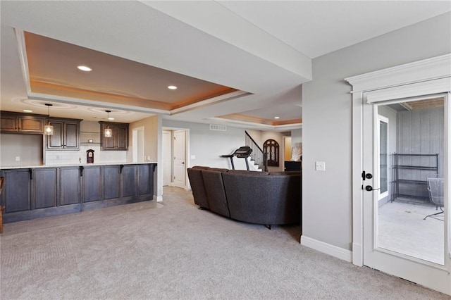 6840 Belmont Dr, Shawnee, KS 66226 - living room with light carpet, a tray ceiling, and recessed lighting