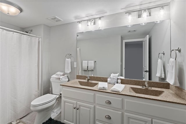 6840 Belmont Dr, Shawnee, KS 66226 - full bathroom with double vanity, visible vents, toilet, and a sink