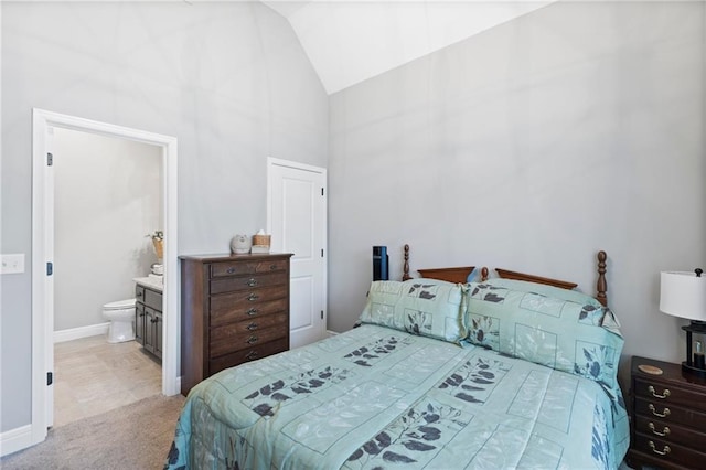 6840 Belmont Dr, Shawnee, KS 66226 - bedroom with baseboards, ensuite bath, carpet flooring, and high vaulted ceiling