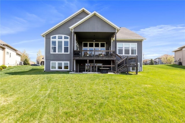 6840 Belmont Dr, Shawnee, KS 66226 - rear view of house featuring stairs, a ceiling fan, a yard, and a deck