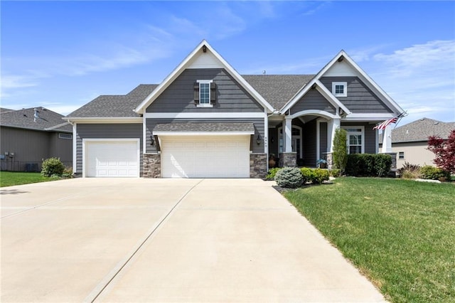 6840 Belmont Dr, Shawnee, KS 66226 - craftsman-style house featuring a front lawn, a porch, stone siding, concrete driveway, and a garage