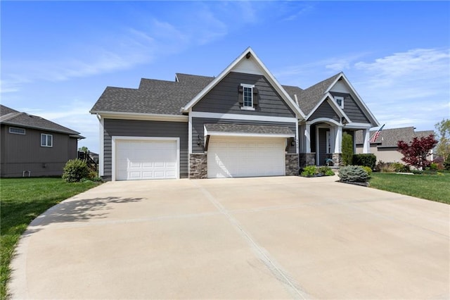 6840 Belmont Dr, Shawnee, KS 66226 - craftsman house with an attached garage, driveway, a front lawn, and stone siding