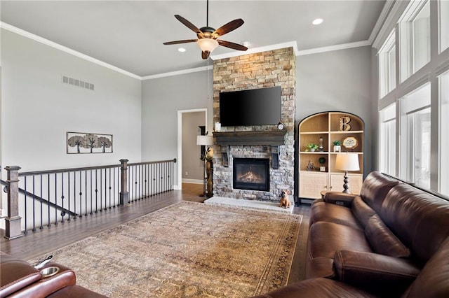 6840 Belmont Dr, Shawnee, KS 66226 - living room featuring ceiling fan, wood finished floors, ornamental molding, a fireplace, and recessed lighting