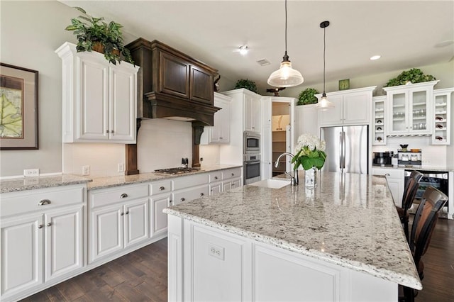6840 Belmont Dr, Shawnee, KS 66226 - kitchen with appliances with stainless steel finishes, dark wood-style flooring, white cabinetry, and recessed lighting