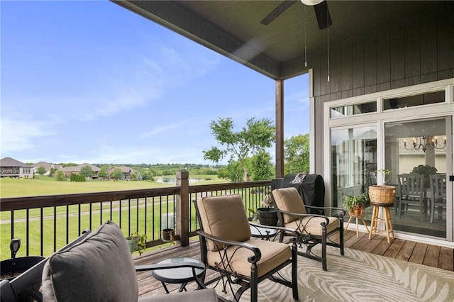 6840 Belmont Dr, Shawnee, KS 66226 - deck featuring ceiling fan and a lawn