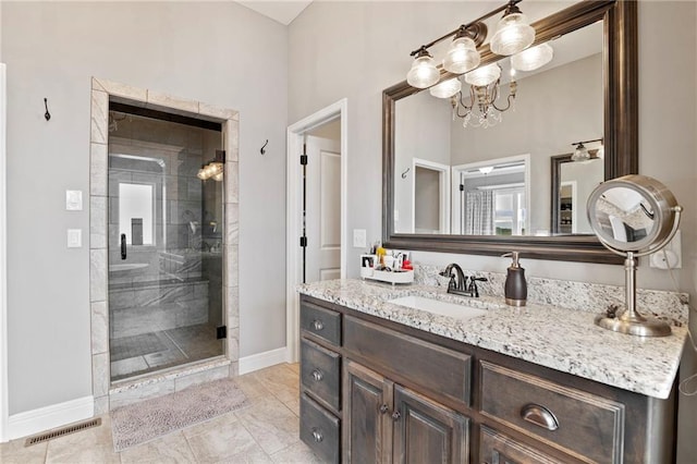 6840 Belmont Dr, Shawnee, KS 66226 - full bath with a shower stall, vanity, and a chandelier