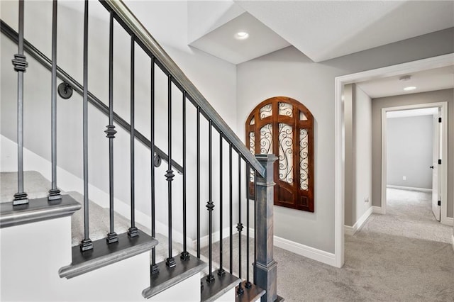 6840 Belmont Dr, Shawnee, KS 66226 - foyer featuring carpet flooring, arched walkways, recessed lighting, and stairway