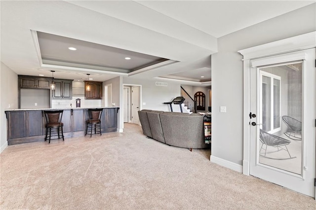 6840 Belmont Dr, Shawnee, KS 66226 - living room with a raised ceiling, light carpet, recessed lighting, and stairway