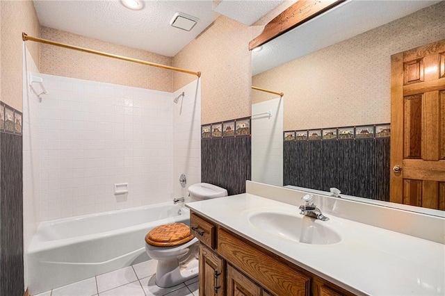 full bathroom featuring tile patterned floors, wallpapered walls, toilet, shower / washtub combination, and vanity