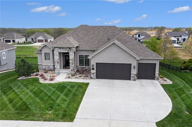 view of front of property with fence, a front lawn, stucco siding, an attached garage, and stone siding