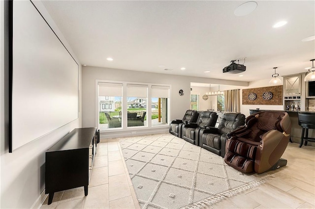 home theater room with light tile patterned floors, baseboards, and recessed lighting