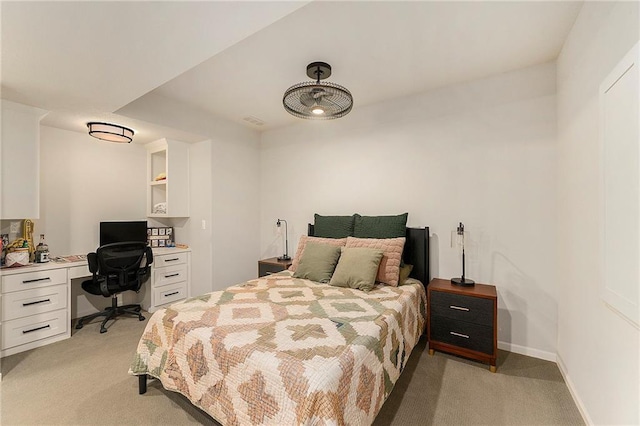 bedroom featuring light carpet and baseboards