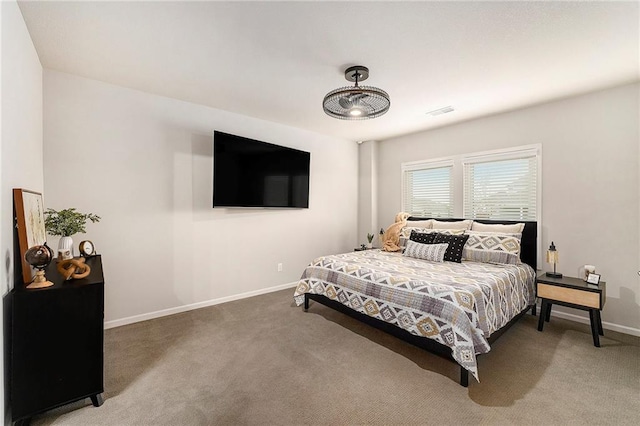 carpeted bedroom with baseboards and visible vents