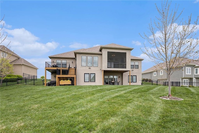rear view of property with a yard, roof with shingles, a fenced backyard, and stucco siding
