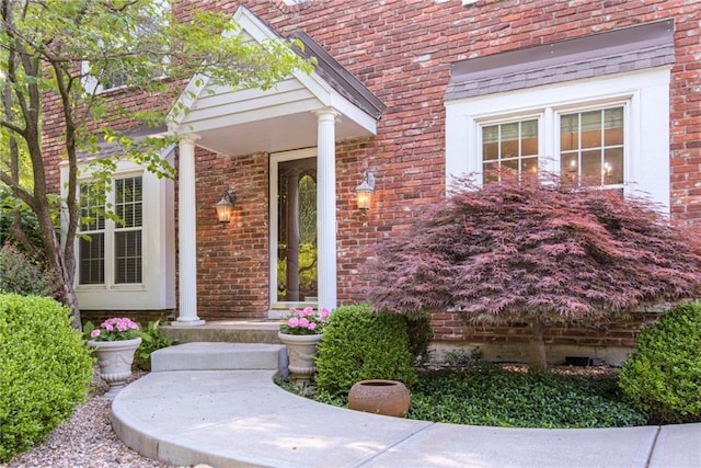 entrance to property with brick siding